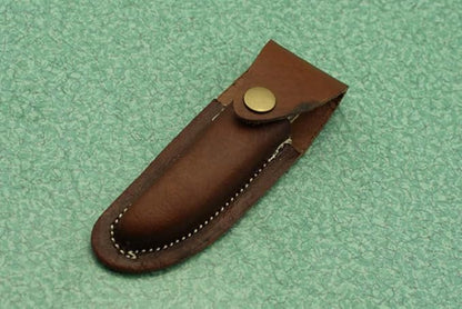 Laguiole Folding Damascus steel knife, 8.6" Long with 4" hand forged custom twist pattern Blade. Blue colored wood with brass bolster, Cow hide leather sheath included